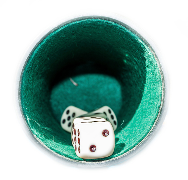 Vintage yahtzee cup lined with felt with dice inside looking in