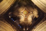 looking up to cathedral roof lots of stained glass