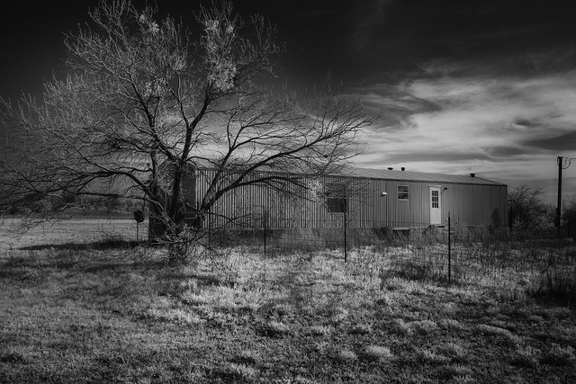 trailer underneath ominous sky