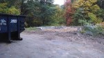 empty lot with dumpster out front