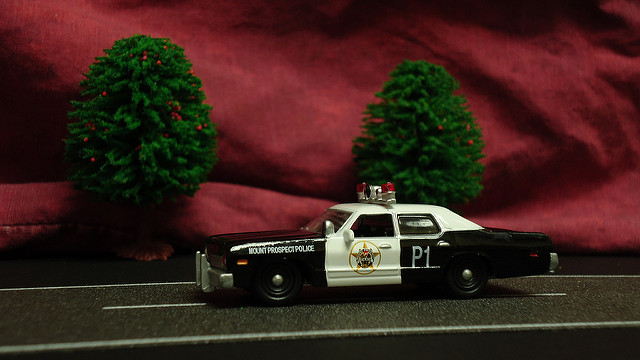 Toy cop car in diaroma display