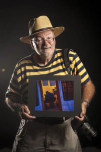 William crawford holding one of his photos