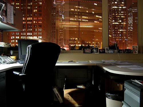 Corner office empty in the evening looking out to city