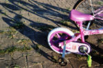 pink tricyle with shadows