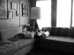 author's grama's couch - retro, round pillos, pics on wall, lamp