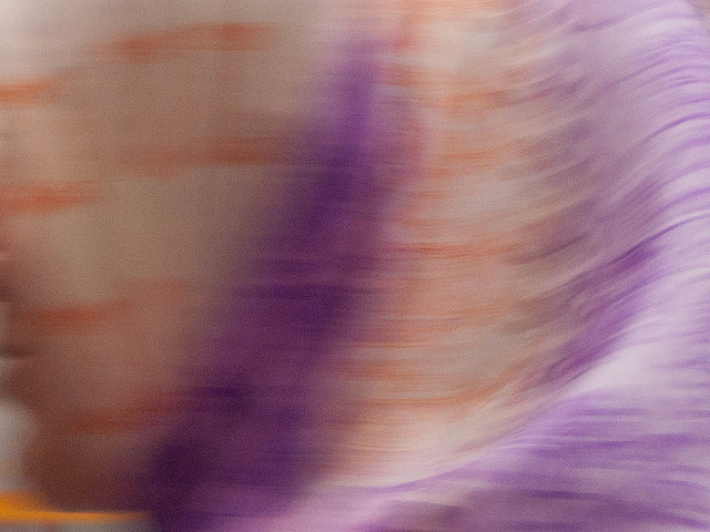Abstract shadowy image of a woman in a scarf but it almost looks like a wave of water