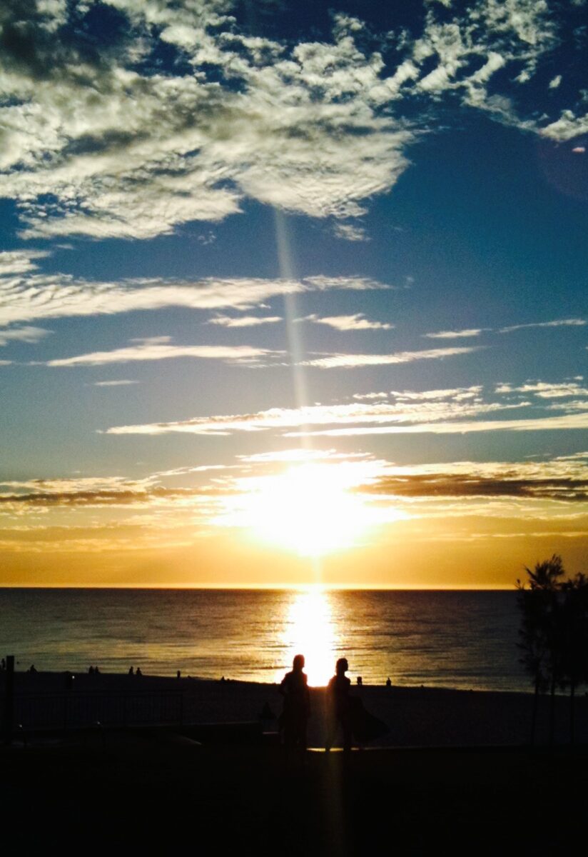 lake at sunset with still some blue sky and clouds