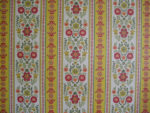 close up of patterned wallpaper pink flowers with green stems on white and yellow background