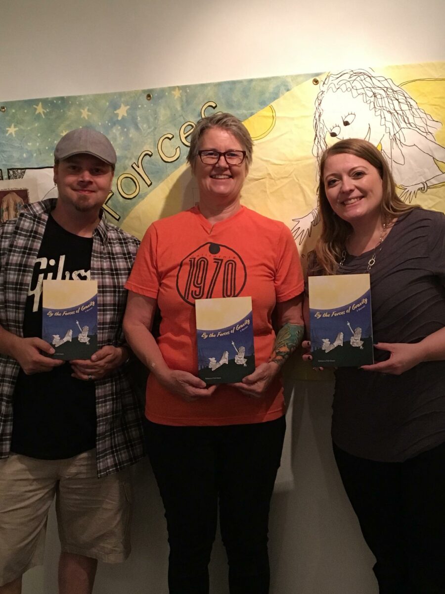 kevin, rebecca and donna holding rebeccas book