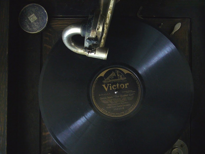 close-up image of record on player that says "victor"