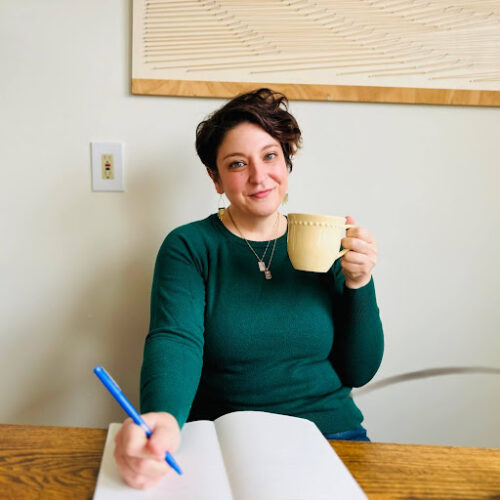 Rae Pagliarulo with coffee mug and journal