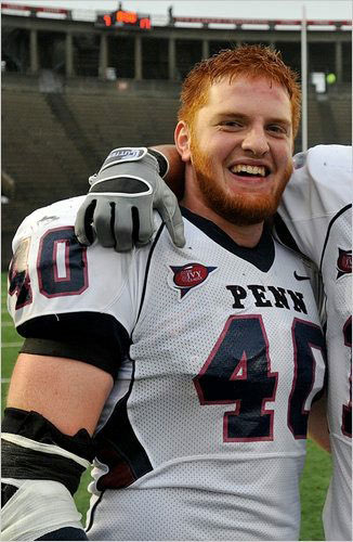 Owen Thomas stands in Penn football uniform