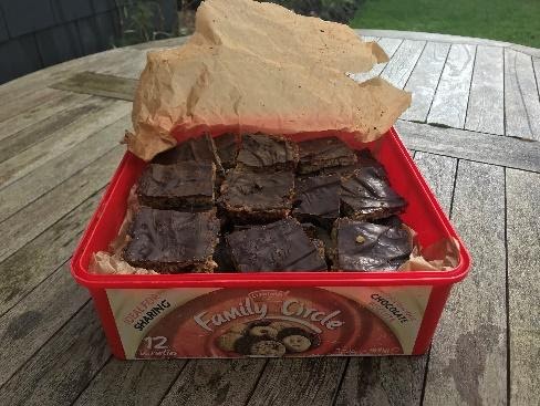 Baked treats in a cookie tin what the author's mom calls crisis crisps