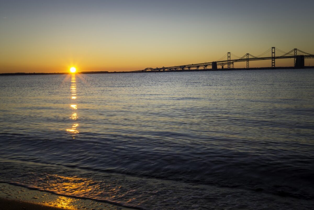 The sunrises over the Chesapeake Bay Bridge.