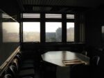 dark boardroom overlooking downtown