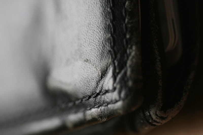 close-up shot of worn, leather wallet