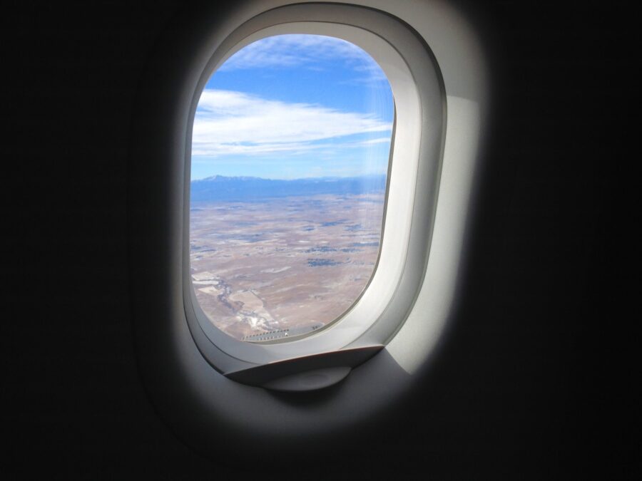 airplane window looking out to desert