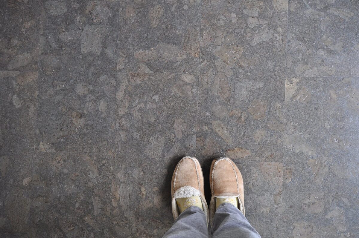 slippered feet on stone floor