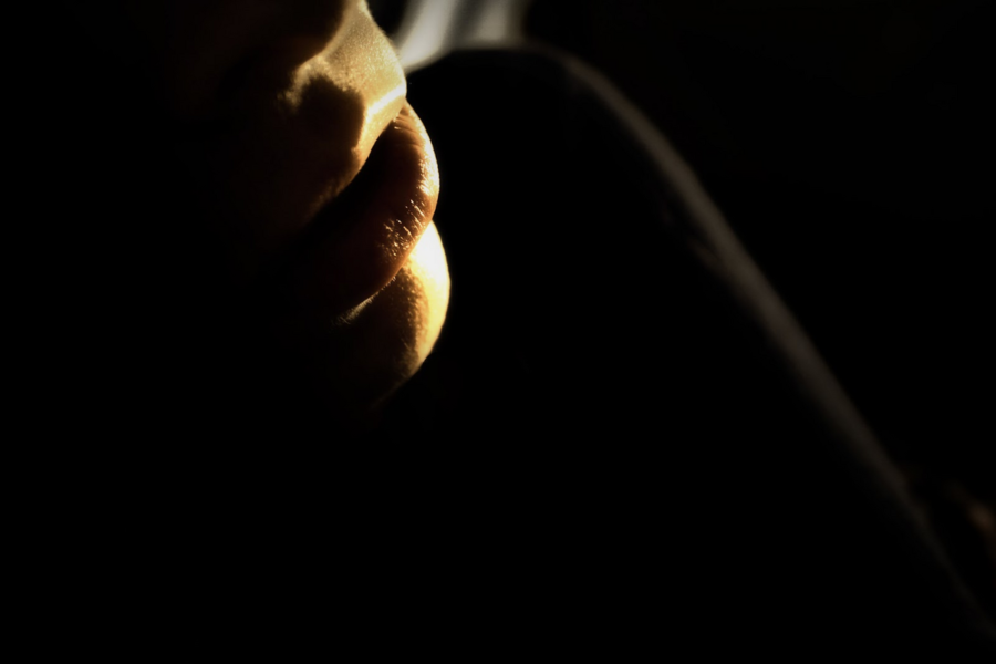 close-up of lips blowing out smoke