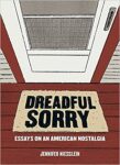 The book title Dreadful Sorry is seen on a welcome mat in front of a white door