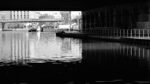 under a bridge of a city canal