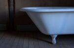 clawfoot tub on wooden floor