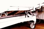 wheels of hospital bed on floor