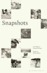 A close-up of a book cover, Snapshots, edited by Dinah Lenney - white background with older polaroids scattered