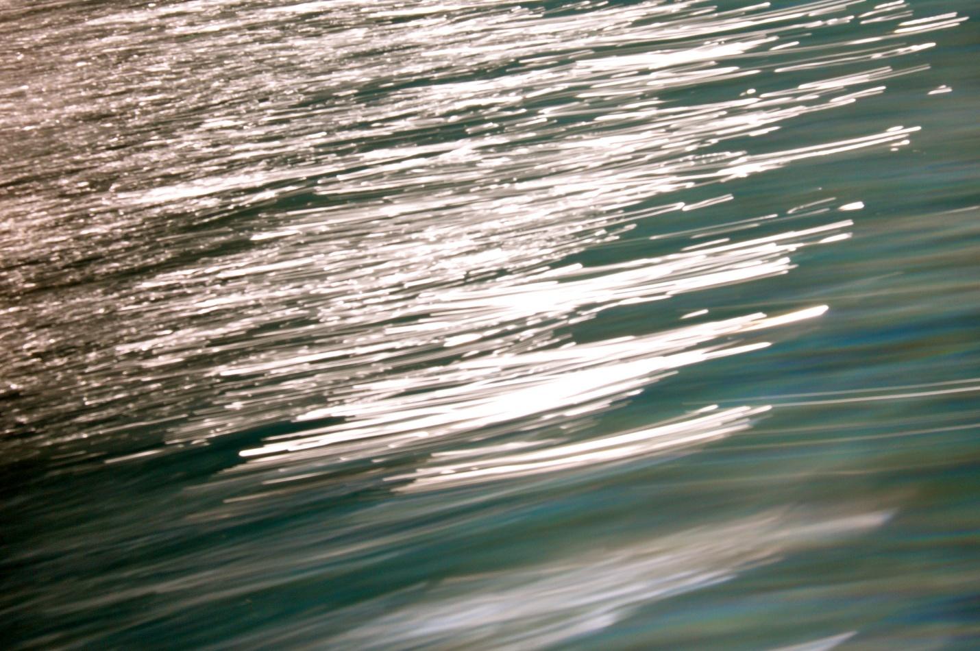 close-up shot of body of water, slight motion and hint of sun