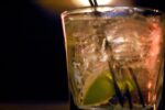 mixed drink with lime and ice