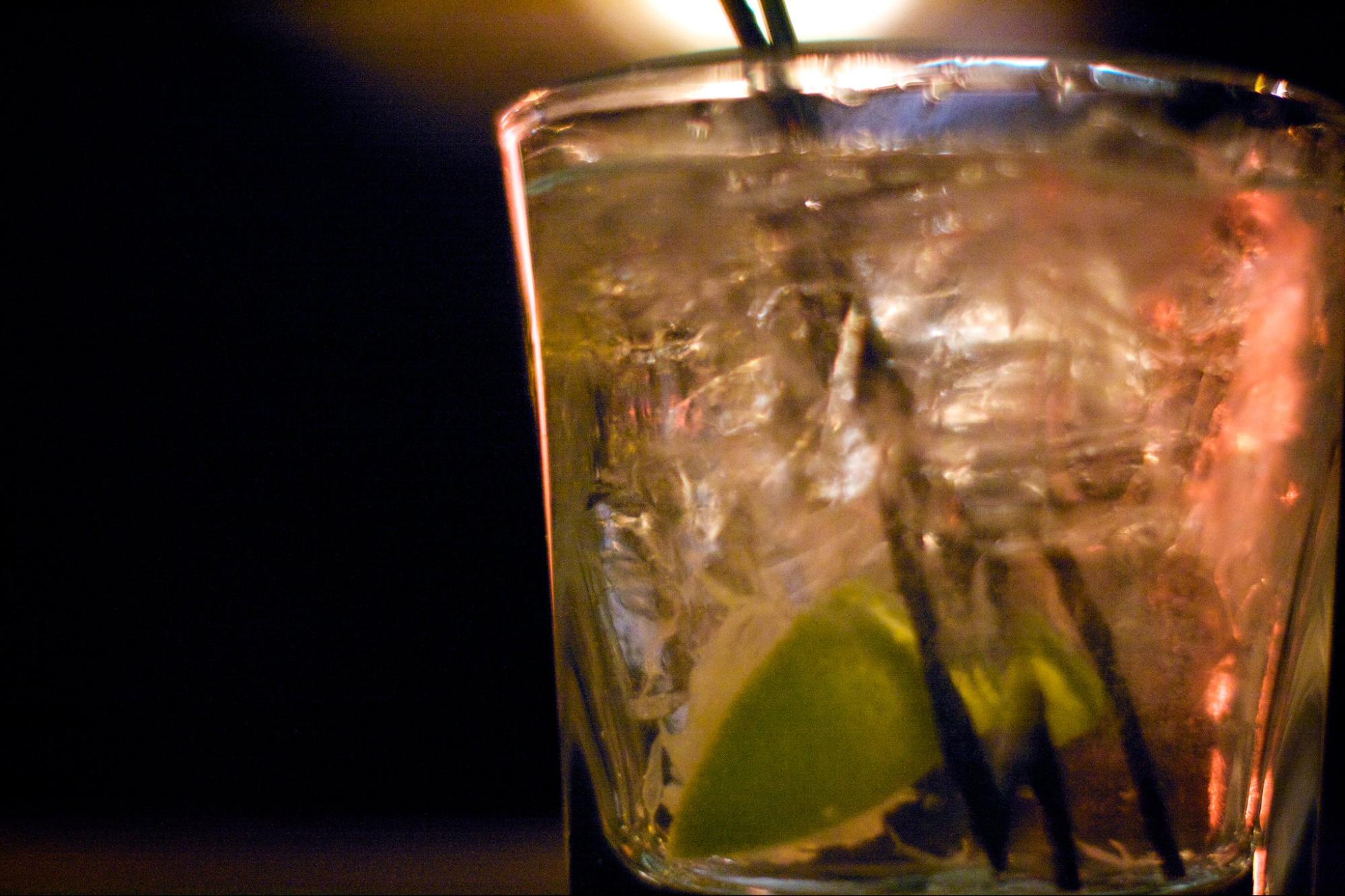 mixed drink with lime and ice