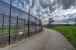 exterior of prison gate on cloudy day
