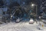 snow covered street; tire tracks, cars with fluffy snow
