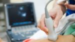 ultrasound technician equipment in use at work